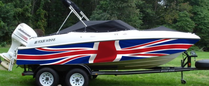 Four Winns speedboat with a Union Jack hull wrap, on a trailer