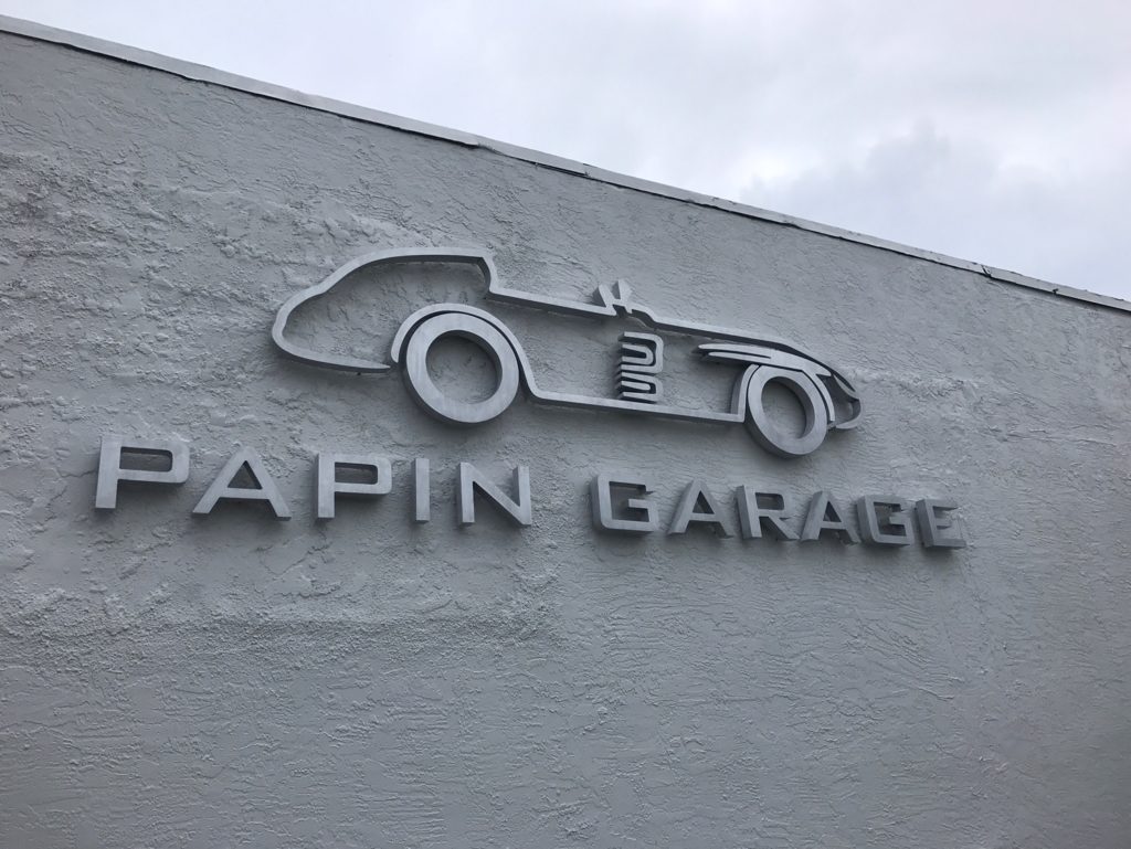 Non illuminated flat cut dimensional letters and logo, flush mounted on a painted exterior wall, fabricated by Graphink in Miami